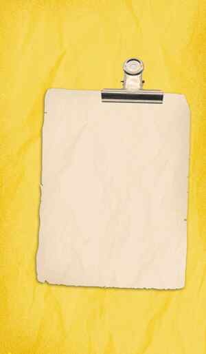 黄色背景上的复古纸张与夹子图片